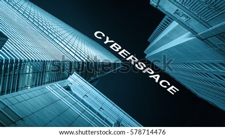 Modern buildings from low angle at night with text cyberspace