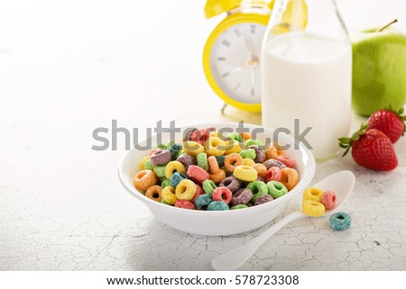 Fruit colorful sweet cereals in a bowl, traditional quick breakfast or snack for kids