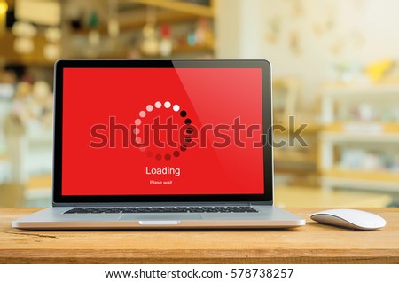 Laptop on table with loading bar load waiting on digital display,  indicator concept. Royalty-Free Stock Photo #578738257
