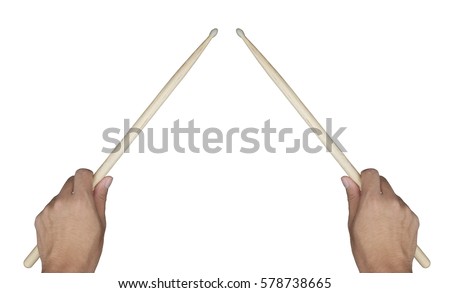 Two hands of drummer holding drum sticks isolated on white in ready position to play drum Royalty-Free Stock Photo #578738665