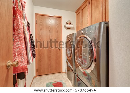 Laundry room interior with modern stainless steel appliances. Northwest, USA