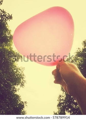 pink heart balloon in my hand
