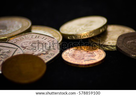Pile of British Coins on the dark background