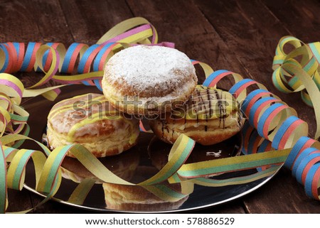 Close up Tasty Sugared Round Berliner Donuts. Carnival for Dessert on Wooden Table