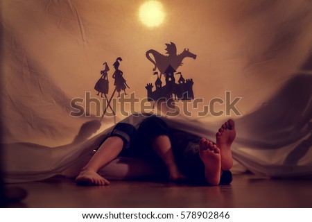 Little children play in the shadow theatre.Theatre. Childhood. Tale. Royalty-Free Stock Photo #578902846