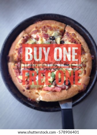 Pizza advertise to promote sales. with Buy One Free one text on a dark background