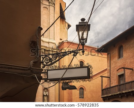 Image of vintage cobbler shop sign in Bologna, italy.