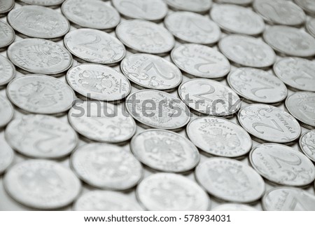 collection of two-rubles coins on white surface