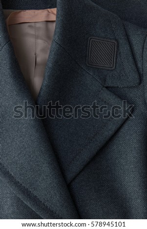 Label on a Grey Trench Coat