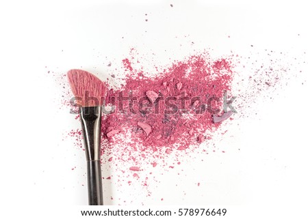 Makeup brush on white background, with vibrant traces of powder and blush. A horizontal template for a makeup artist's business card or flyer design, with plenty of copy space