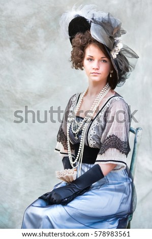 Portrait of the girl  old fashioned dress  Royalty-Free Stock Photo #578983561