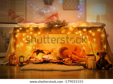 Hovel decorated with garland for children's party at home