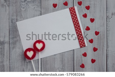 Valentines day, Love concept. Valentines card and red hearts. Two red lollipops heart shape.