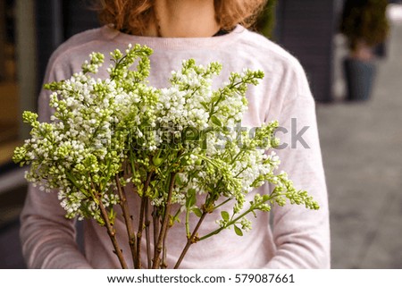 bouquet of flowers in girl's hands