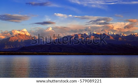 lake and mountains landscape view on sunset
