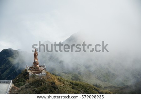 The guan yim statue in fan si pan mountian with white mist