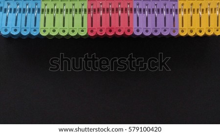 Clothespin clips isolated on black Background

