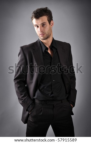 a man dressed in black business suit