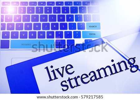 Live Streaming word in business concepts, technology background in laptop and notepad