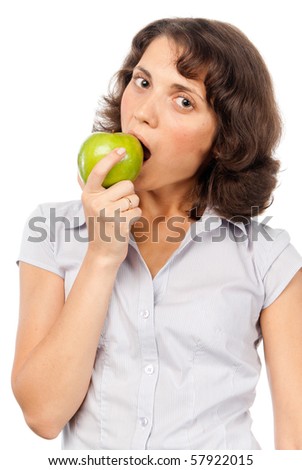 Pretty girl eats a green apple