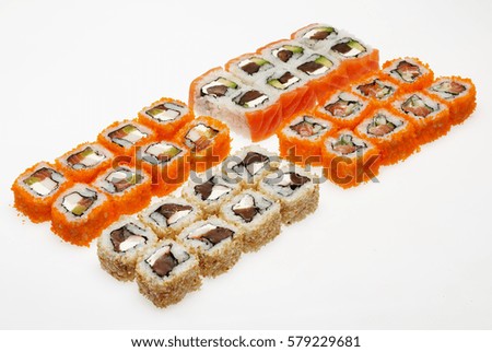 Different types of roll sushi on a plate isolated on white background.