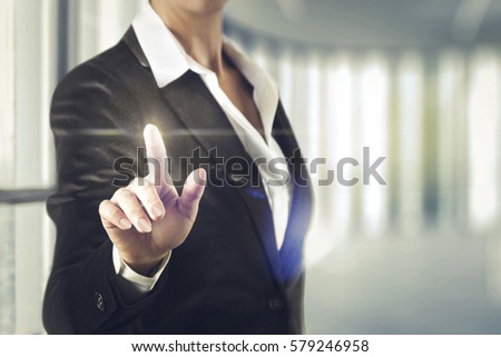 Business women touching the abstract screen