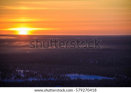 Dramatic sunset in Lapland. Northern Finland in February. Ivalo. Saariselka