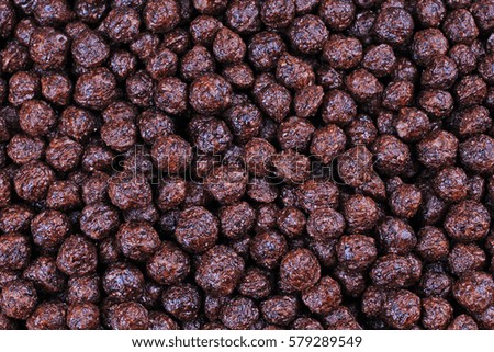 Chocolate cereal balls texture pattern as background. 