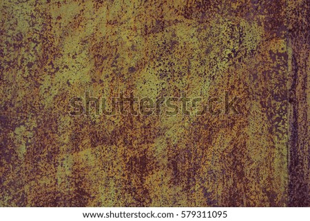 Iron background covered with rust and yellow paint