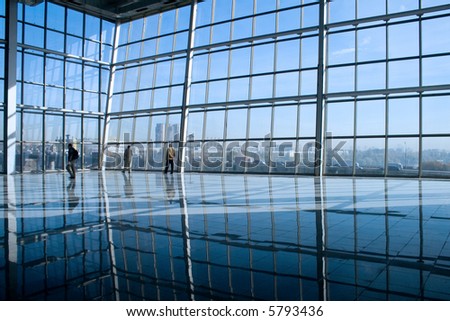 People silhouettes at office building Royalty-Free Stock Photo #5793436