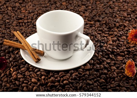Cup of coffee, cinnamon and coffee