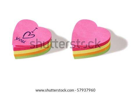 two piles of heart shaped post it notes. One blank and one with the message 'I love you'