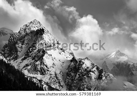 Black and white picture of snowy mountain peak 