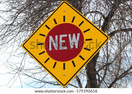 New Traffic Signal Sign Against Tree Branches