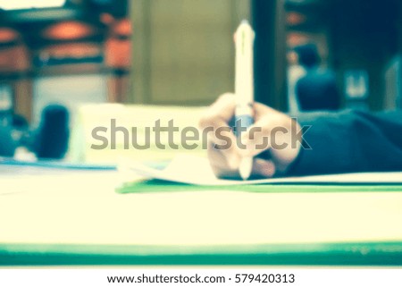 Picture blurred  for background abstract and can be illustration to article of people hand write