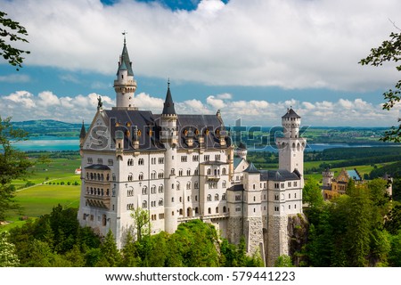 Summer landscape - view of the famous tourist attraction in the Bavarian Alps - the 19th century Neuschwanstein castle. Royalty-Free Stock Photo #579441223
