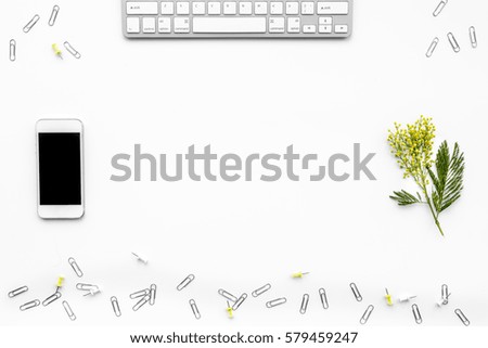 female desktop with smartphone and flowers top view mock up