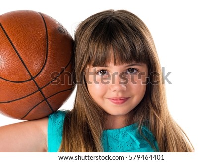 Little girl playing basketball