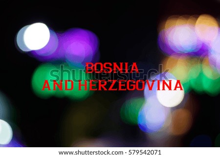 Multicolor light from LED lights close up and bokeh with a wording of BOSNIA AND HERZEGOVINA. Country name concept for education. 