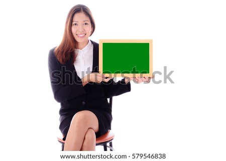 Smiling businesswoman sitting and holding green banner for video on white background.
