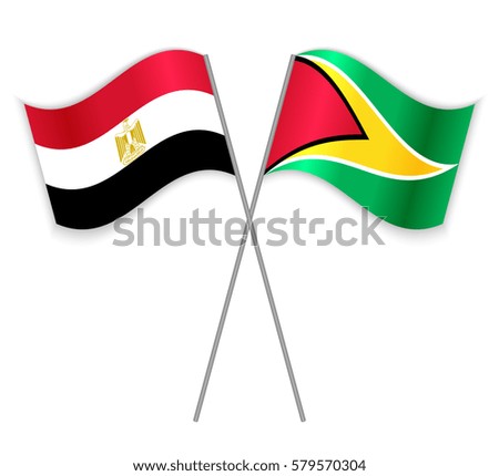 Egyptian and Guyanese crossed flags. Egypt combined with Guyana isolated on white. Language learning, international business or travel concept.