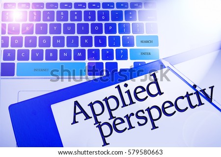 APPLIED PERSPECTIV word / term  in business concepts, technology background in laptop and notepad