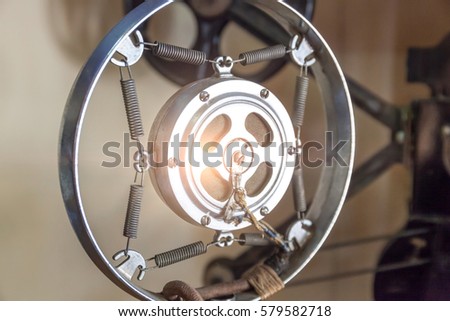 Closeup shiny steel retro microphone stand, vintage style in sound recording room.