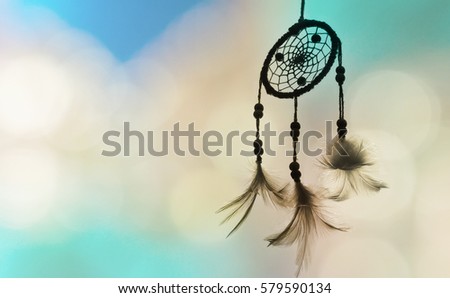 Dream catcher and light green color with blurred focus for background,