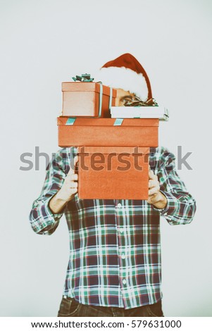 Santa holding gifts.