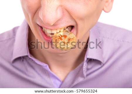man with one gold bitcoin coin on a tooth isolated on white background
