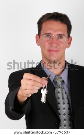 Handsome business men hold key in his hand