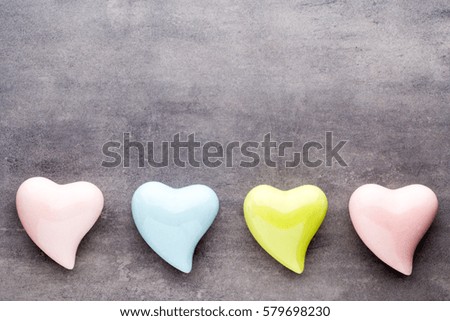 Valentines day greeting card. Colored heart on the gray background.