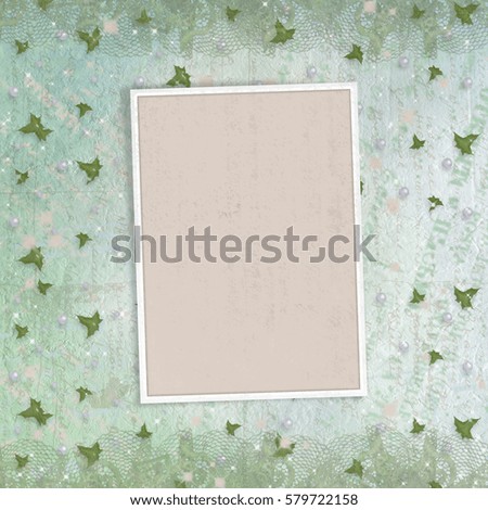 Old paper photo frame on the vintage abstract background