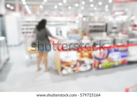 Picture blurred  for background abstract and can be illustration to article of Woman shopping at the supermarket